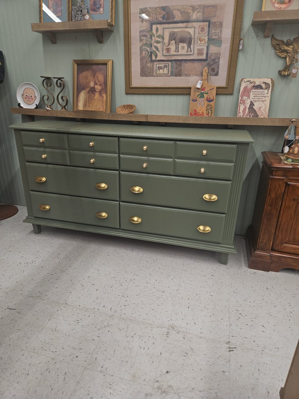 Olive green dresser with brass cup pulls, refinished by Redeemed & Renewed